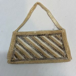 Small synthetic, pearl hand purse clutch wristlet